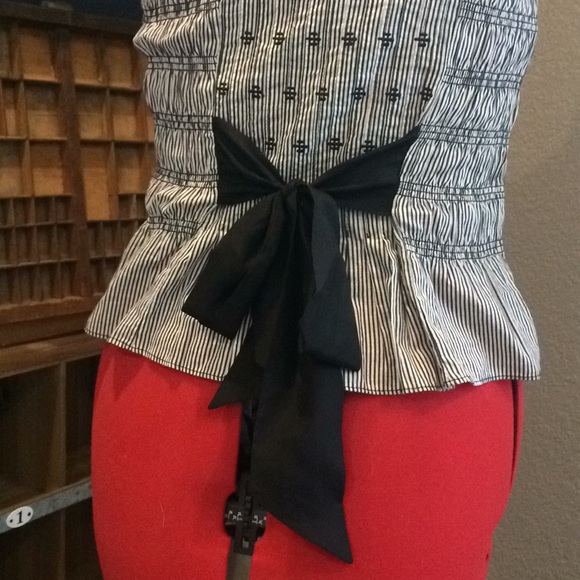 Black and white striped peplum top with bow. - Picture 2 of 3
